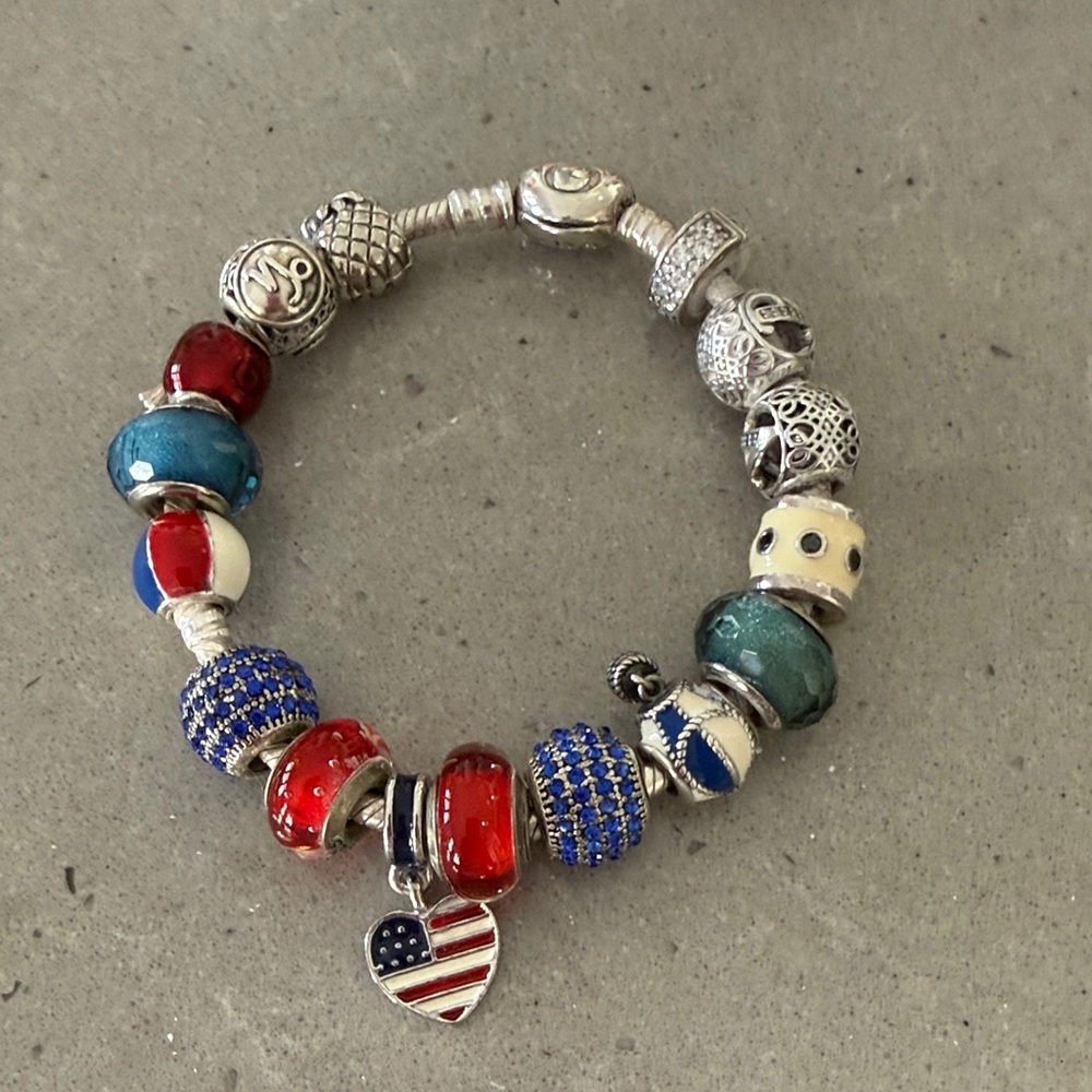 Pandora Silver Bracelet with Red, Blue, and Cream Charms